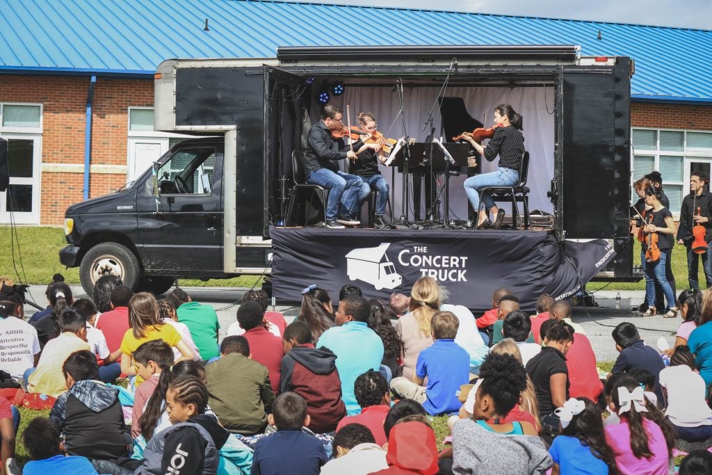 Four Seasons musicians perform on board The Concert Truck during a Community Tour.