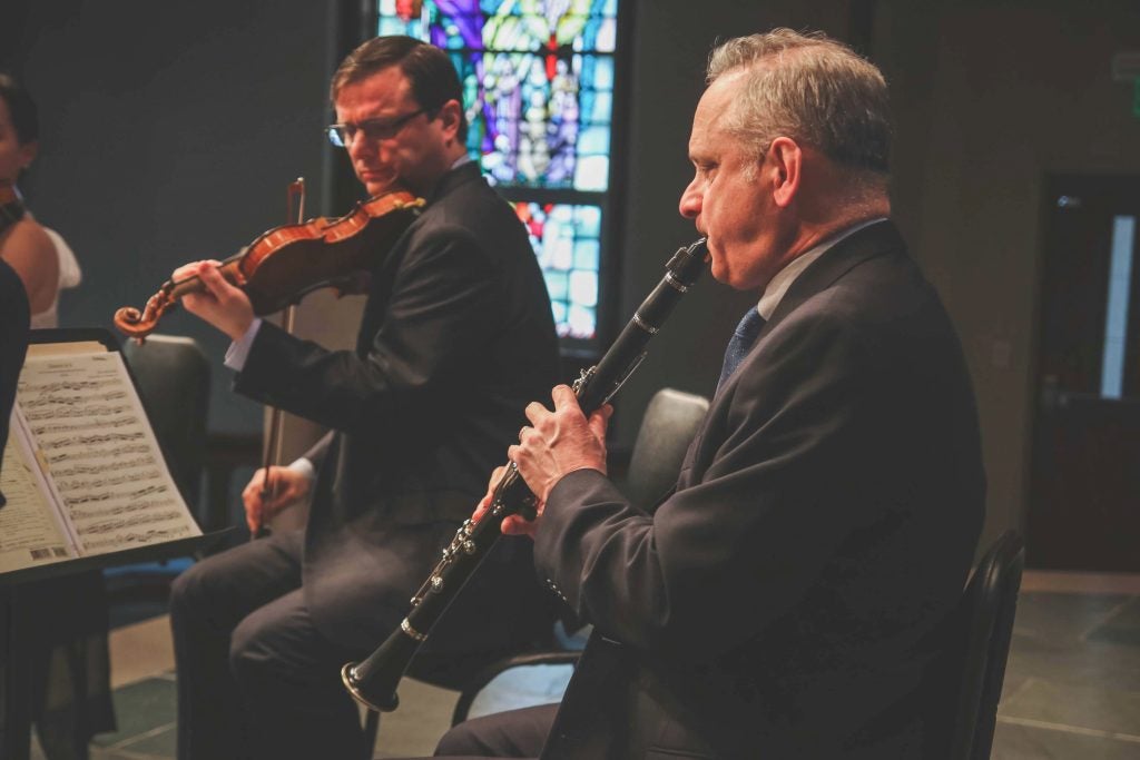 Violinist Ara Gregorian and clarinetist Alan Kay perform during a Signature Series concert in Raleigh.